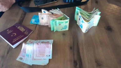Dinlenme tesisinde unutulan içinde döviz bulunan çantayı polise teslim etti
