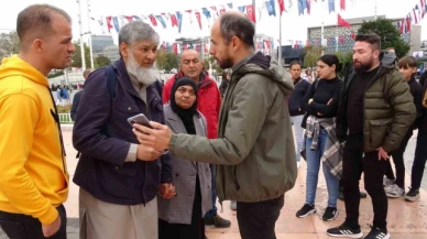 Eşinin çantasını soymaya çalışan kadını yakalayarak polise teslim etti