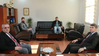 Bakan'dan Dayıoğlu'na iade-i ziyaret