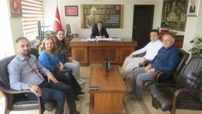 ÇİMEN VE YÖNETİMİ KAYMAKAM GÜLDOĞAN’I ZİYARET ETTİ
